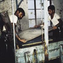 Papermaking team operating deckle box, Aurangabad, Maharashtra, India, 1985